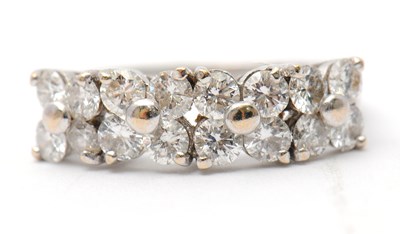Lot 20 - An 18ct diamond ring, set with round brilliant...