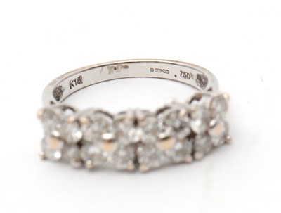 Lot 20 - An 18ct diamond ring, set with round brilliant...