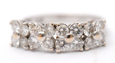 Lot 20 - An 18ct diamond ring, set with round brilliant...