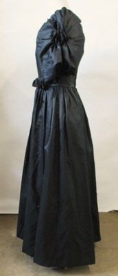 Lot 56 - John Charles: a 1980's black satin gown, with...