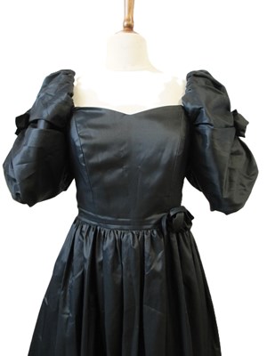 Lot 56 - John Charles: a 1980's black satin gown, with...