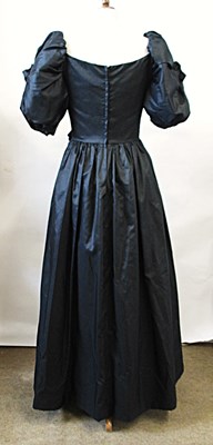 Lot 56 - John Charles: a 1980's black satin gown, with...