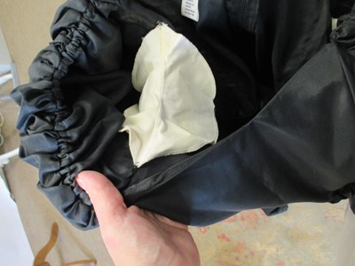 Lot 56 - John Charles: a 1980's black satin gown, with...
