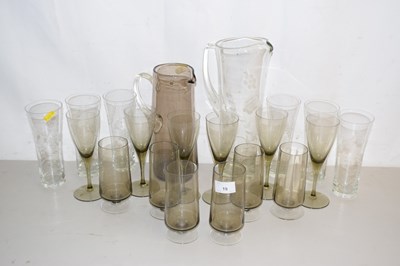 Lot 19 - A quantity of smoked glass wares together with...
