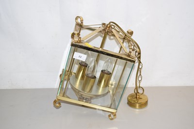 Lot 22 - A brass framed hanging lantern
