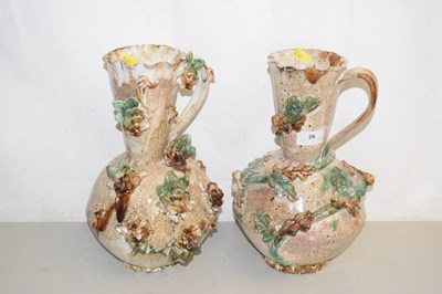 Lot 26 - A pair of floral encrusted ceramic vases, no...
