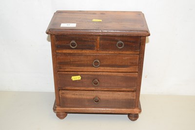 Lot 37 - A hardwood tabletop four drawer chest