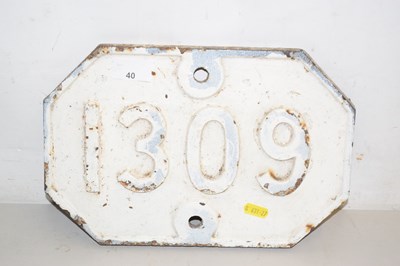 Lot 40 - An iron railway plate marked 1309