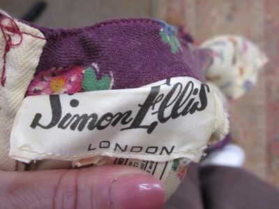 Lot 38 - Marion Donaldson: a plum striped and velvet...