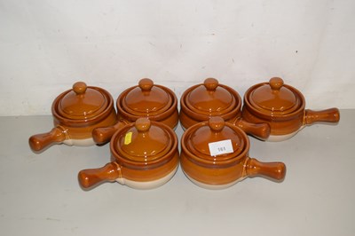 Lot 161 - A set of six brown glazed covered soup dishes