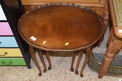 Lot 301 - A nest of three walnut tables