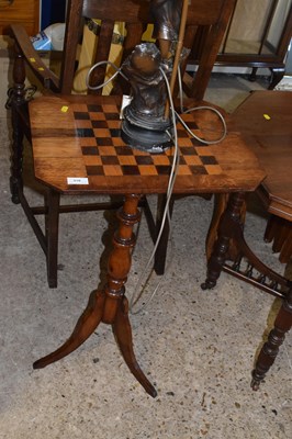 Lot 310 - A Victorian games table with tripod base