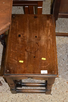 Lot 314 - A nest of two oak tables