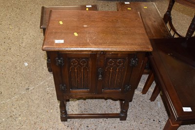 Lot 316 - A modern oak bedside cabinet with Gothic...