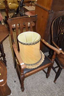 Lot 319 - An early 20th Century oak framed armchair