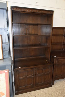 Lot 209 - A dark Ercol bookcase cabinet