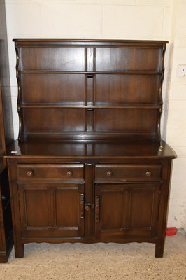 Lot 210 - A dark Ercol dresser