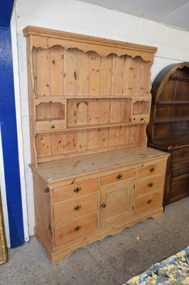 Lot 215 - A late 19th Century pine dresser base with...