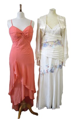 Lot 87 - Two dresses, including an apricot chiffon...