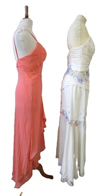 Lot 87 - Two dresses, including an apricot chiffon...