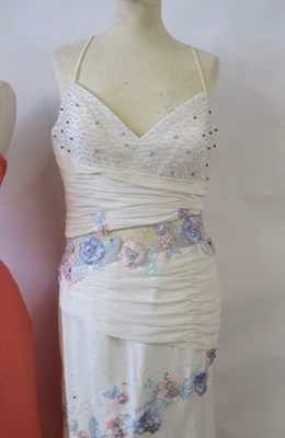 Lot 87 - Two dresses, including an apricot chiffon...