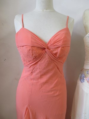 Lot 87 - Two dresses, including an apricot chiffon...