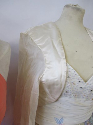 Lot 87 - Two dresses, including an apricot chiffon...