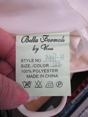 Lot 87 - Two dresses, including an apricot chiffon...