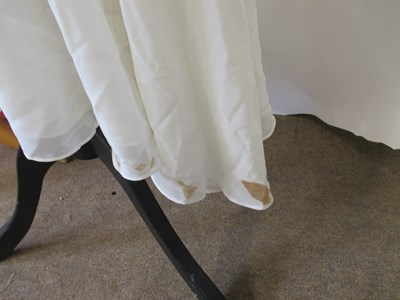 Lot 87 - Two dresses, including an apricot chiffon...