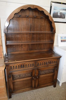 Lot 216 - A 20th Century reproduction dark oak dresser...