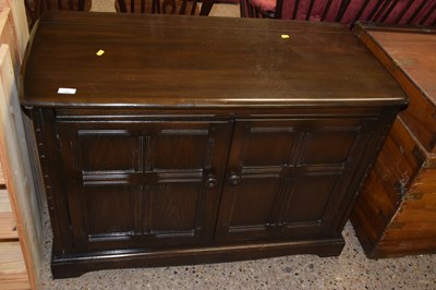 Lot 260 - A dark Ercol two door sideboard