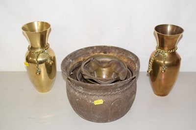 Lot 515 - Pair of brass vases with rope decoration...