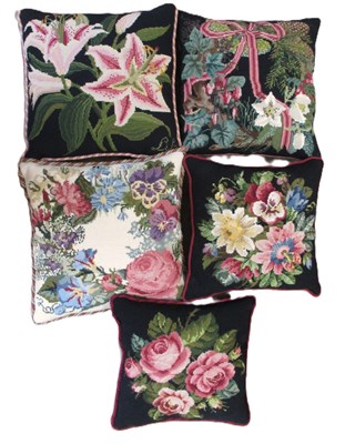 Lot 235 - Five needlepoint cushions, to include designs...