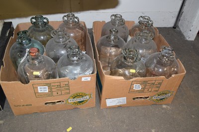 Lot 648 - Two boxes of glass demi johns