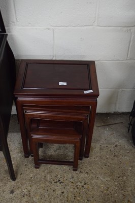 Lot 402 - NEST OF THREE ORIENTAL HARDWOOD TABLES, 43CM WIDE