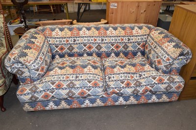 Lot 717 - A patterned two seater sofa
