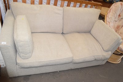 Lot 720 - Beige two seater sofa