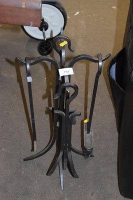 Lot 734 - An iron fire tool set