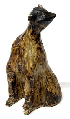 Lot 234 - A ceramic sculpture of a leopard with a...