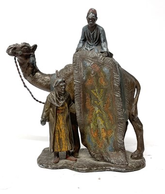 Lot 237 - A cold painted Spelter group of a camel with...
