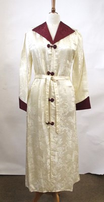 Lot 17 - An early 20th century cream and burgundy satin...