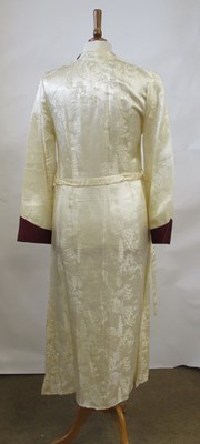 Lot 17 - An early 20th century cream and burgundy satin...