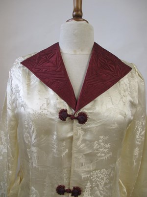 Lot 17 - An early 20th century cream and burgundy satin...
