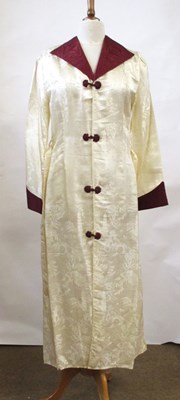 Lot 17 - An early 20th century cream and burgundy satin...