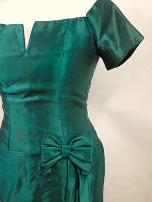Lot 36 - A green satin cocktail dress, with short...
