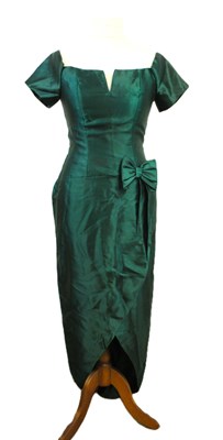 Lot 36 - A green satin cocktail dress, with short...