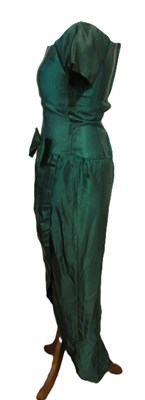 Lot 36 - A green satin cocktail dress, with short...