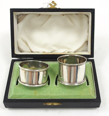 Lot 71 - Two cased hallmarked silver serviette rings,...