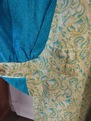 Lot 48 - Two 1970's dresses: including an emerald green...