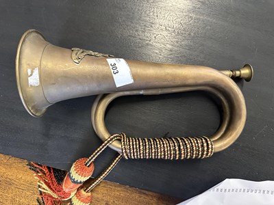 Lot 303 - Military bugle with two tassles and badges for...
